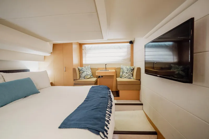 Slide: The Image of Luxurious cabin interior of 2013 Prestige 500S yacht with bed, seating, and TV. - 27