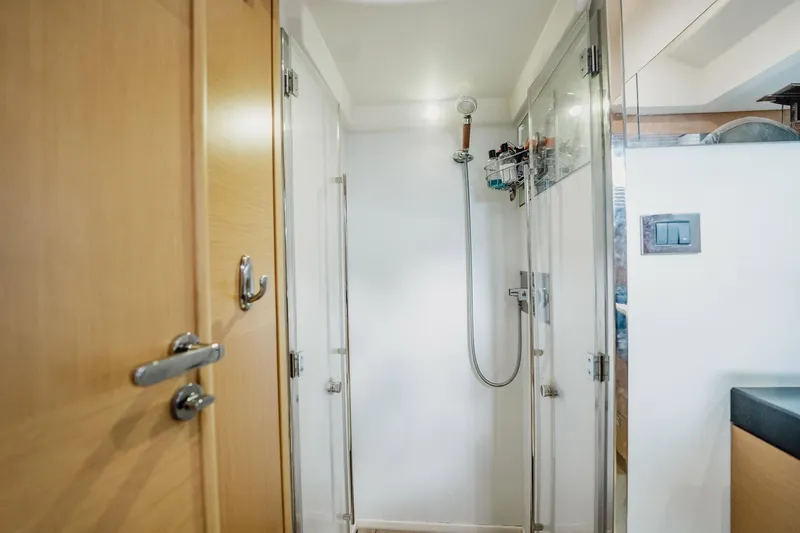 Slide: The Image of Shower area inside 2013 Prestige 500S yacht, featuring modern fixtures and wooden accents. - 28