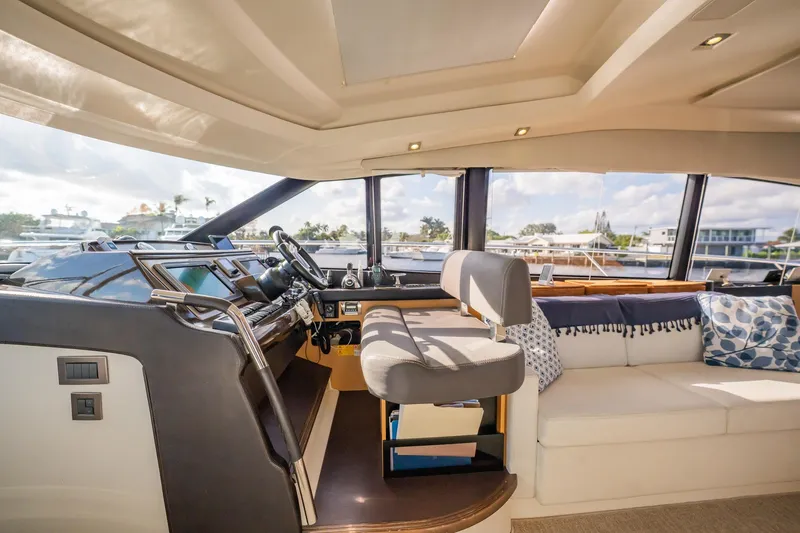 Slide: The Image of Luxurious interior of 2013 Prestige 500S yacht with helm and seating area. - 41