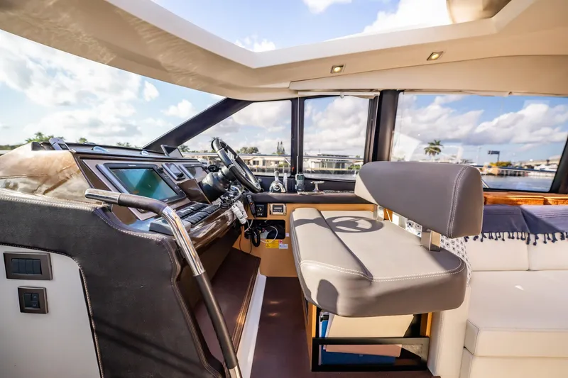 Slide: The Image of Luxurious interior of 2013 Prestige 500S yacht with modern helm and seating. - 48