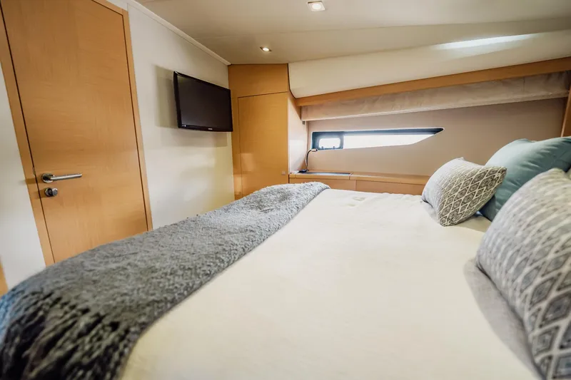 Slide: The Image of Luxurious bedroom interior of 2013 Prestige 500S yacht with modern decor and window view. - 60