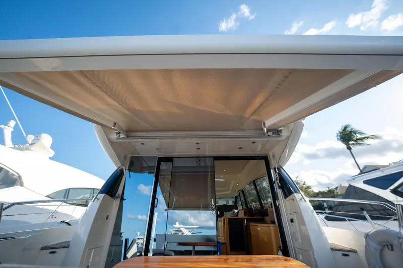 Slide: The Image of Prestige 500S yacht, 2013 model, featuring a spacious deck and modern design under a clear blue sky. - 71