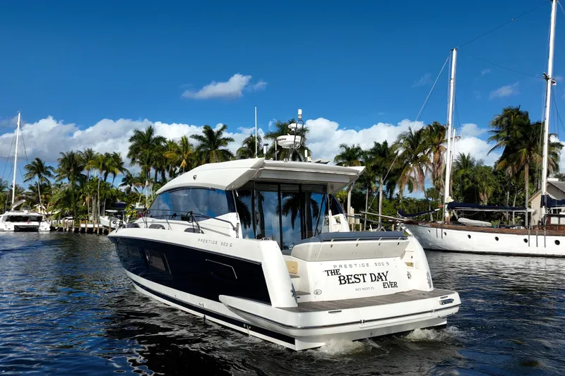Slide: The Image of Prestige 500S yacht cruising in tropical waters, 2013 model, sunny day, palm trees. - 76