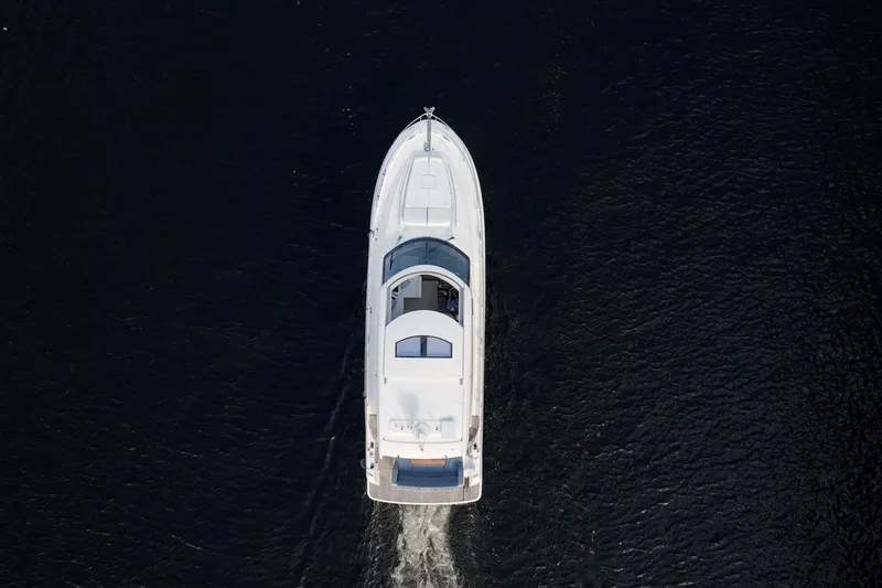 Slide: The Image of Aerial view of 2013 Prestige 500S yacht cruising on dark water. - 82