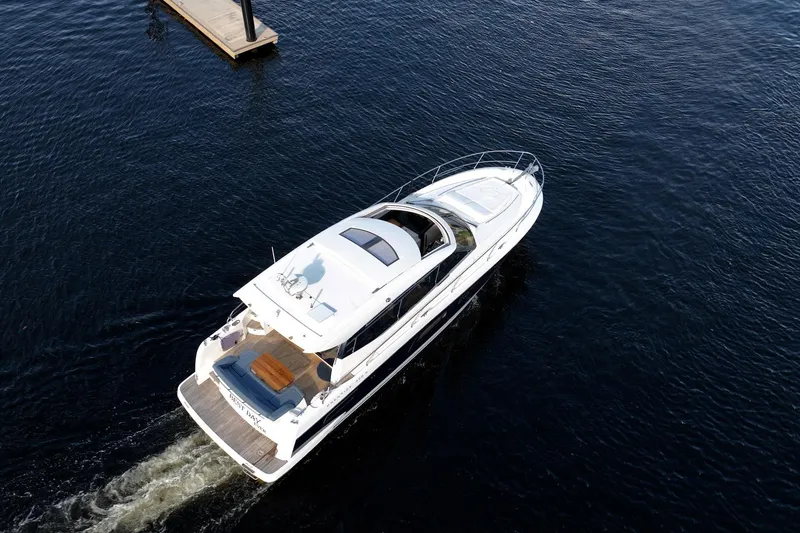 Slide: The Image of Aerial view of 2013 Prestige 500S yacht cruising on open water. - 83