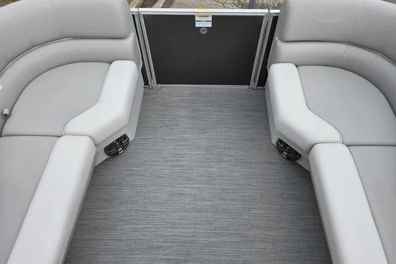 Slide: The Image of Interior of 2025 Godfrey Xperience 2286 SBX Sport Tube, featuring gray seating and flooring. - 10