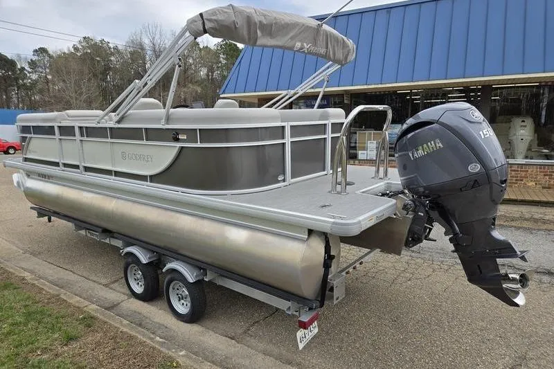 Slide: The Image of 2025 Godfrey Xperience 2286 SBX pontoon boat with Yamaha engine on trailer. - 4