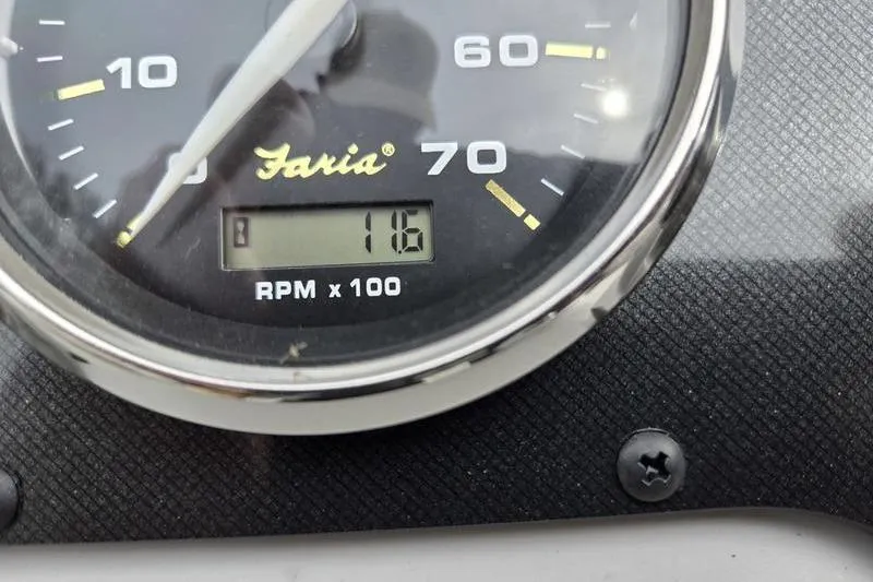 Slide: The Image of Close-up of a Faria tachometer displaying 1180 RPM on a Godfrey Xperience 2286 SBX. - 6