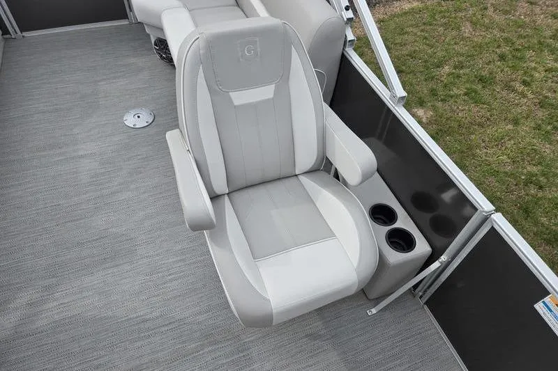 Slide: The Image of Captain's chair on 2025 Godfrey Xperience 2286 SBX Sport Tube boat, featuring cup holders. - 7
