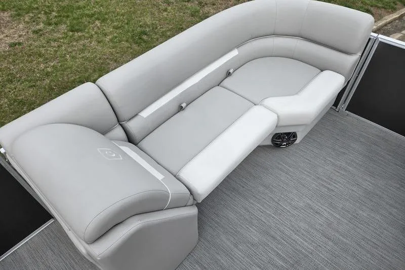 Slide: The Image of Luxurious seating on 2025 Godfrey Xperience 2286 SBX Sport Tube boat, featuring sleek gray upholstery. - 8