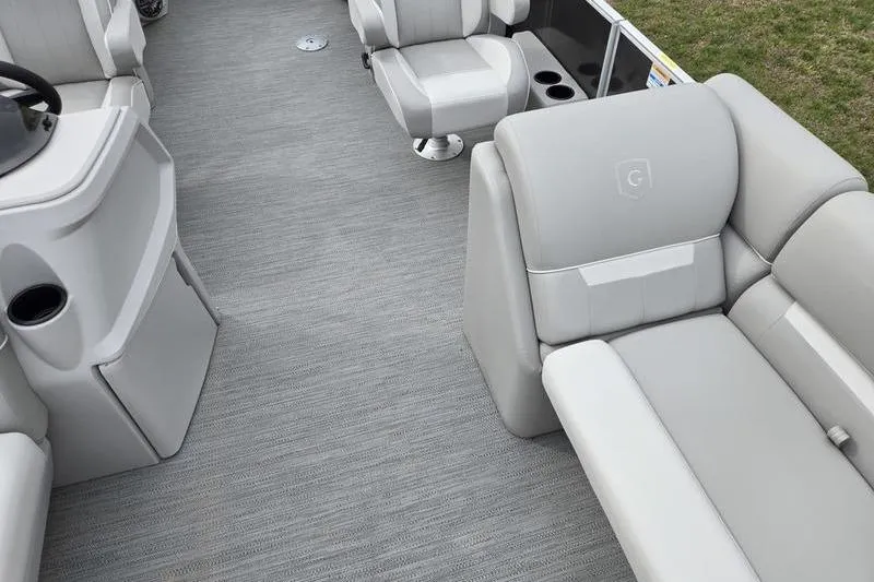 Slide: The Image of 2025 Godfrey Xperience 2286 SBX Sport Tube interior with gray seating and helm. - 9