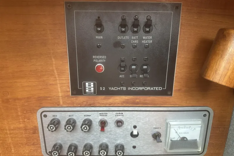 Slide: The Image of Control panel of a 1985 Tiara 25 yacht with switches and voltage meter. - 22