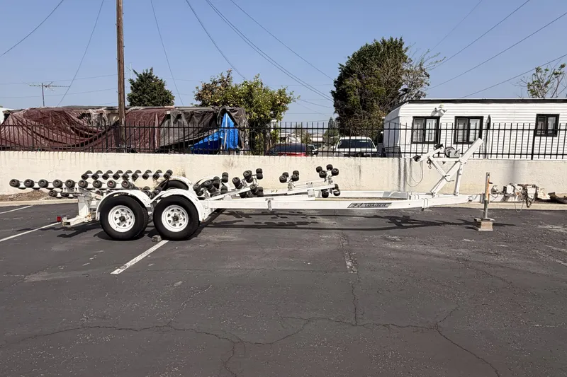 Slide: The Image of 1985 Tiara 2700 Continental boat trailer parked in a lot. - 23