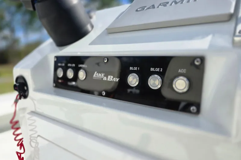 Slide: The Image of Control panel of a 1988 Lake & Bay Boca Grande 20 boat with Garmin equipment. - 13