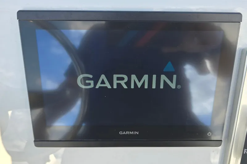 Slide: The Image of Garmin display screen on 1988 Lake & Bay Boca Grande 20 boat dashboard. - 19