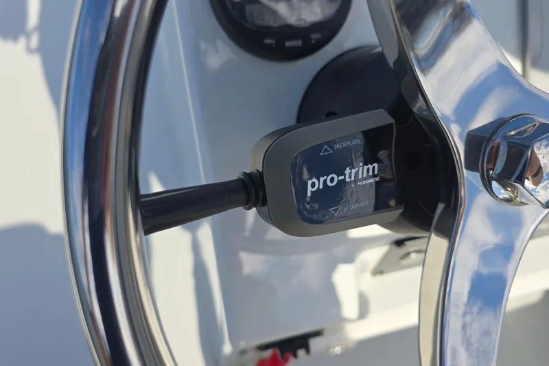 Slide: The Image of Close-up of a 1988 Lake & Bay Boca Grande 20 steering wheel with Pro-Trim control. - 20