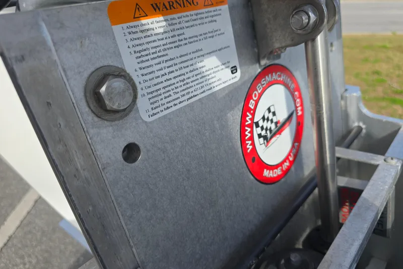 Slide: The Image of Close-up of a 1988 Lake & Bay Boca Grande 20 boat component with warning label. - 22