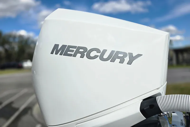 Slide: The Image of White Mercury outboard motor on a 1988 Lake & Bay Boca Grande 20 boat. - 24