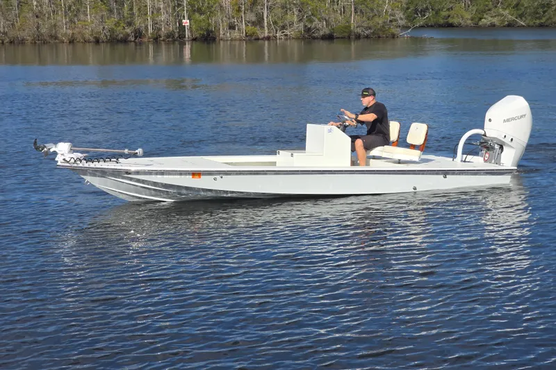 Slide: The Image of 1988 Lake & Bay Boca Grande 20 boat cruising on a calm lake. - 29