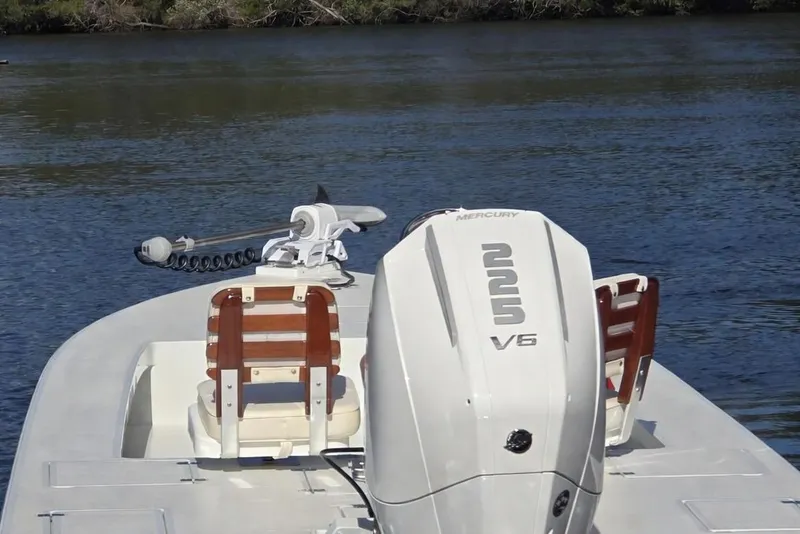 Slide: The Image of 1988 Lake & Bay Boca Grande 20 boat with Mercury V6 engine on calm water. - 3