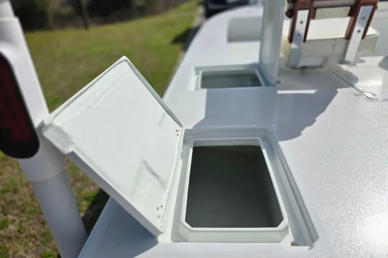 Slide: The Image of Open storage compartments on a 1988 Lake & Bay Boca Grande 20 boat deck. - 34