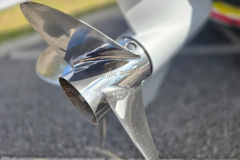 Slide: The Image of Close-up of a shiny boat propeller on a 1988 Lake & Bay Boca Grande 20. - 35