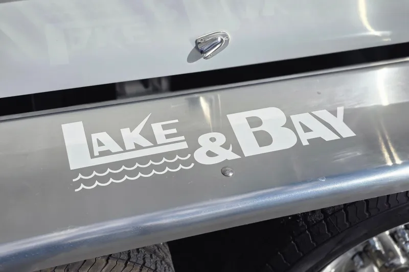 Slide: The Image of Lake & Bay logo on 1988 Boca Grande 20 boat, close-up view. - 36