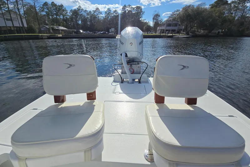 Slide: The Image of 1988 Lake & Bay Boca Grande 20 boat with dual seats on calm water. - 4