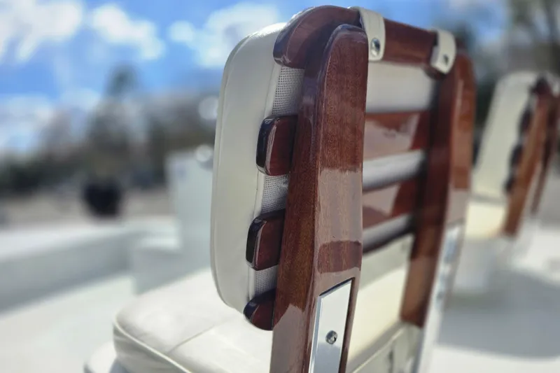 Slide: The Image of Close-up of polished wooden boat seat on 1988 Lake & Bay Boca Grande 20. - 6