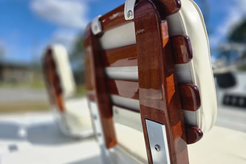 Slide: The Image of Close-up of polished wooden seat detail on 1988 Lake & Bay Boca Grande 20 boat. - 7