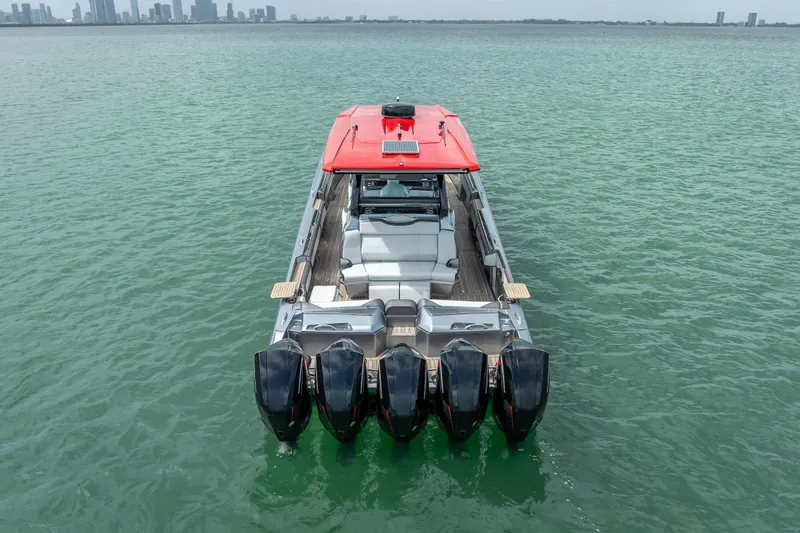 Slide: The Image of 2022 Nor-Tech 500 Sport Center Console boat with red roof on open water. - 1