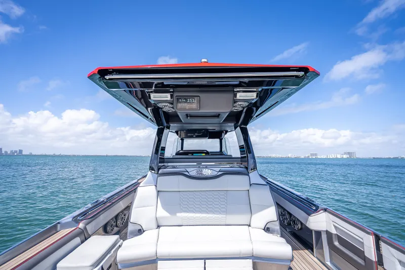 Slide: The Image of 2022 Nor-Tech 500 Sport Center Console on open water under clear blue sky. - 10