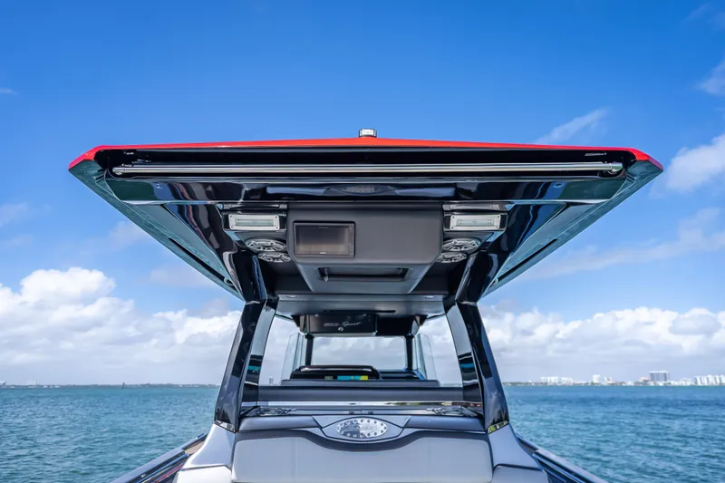 Slide: The Image of 2022 Nor-Tech 500 Sport Center Console boat on open water, showcasing sleek design and modern features. - 11