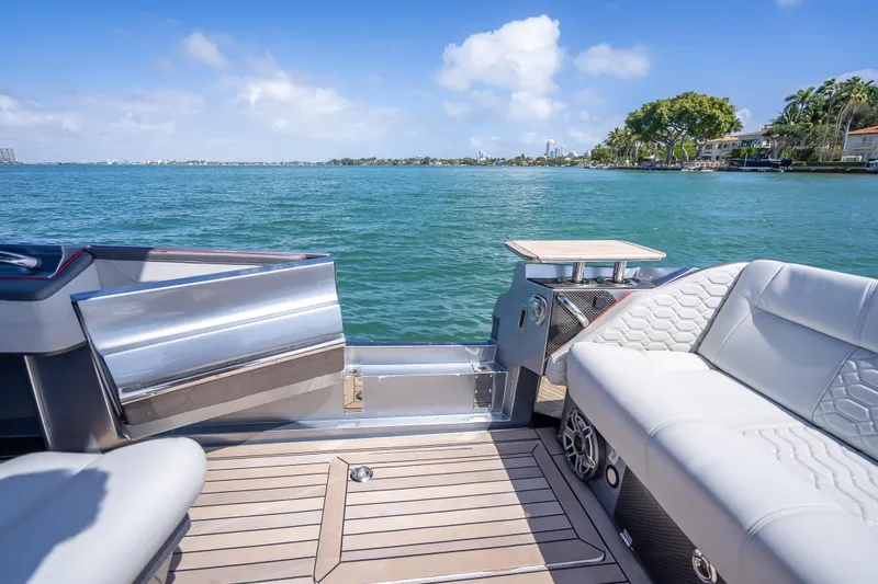 Slide: The Image of Luxurious 2022 Nor-Tech 500 Sport Center Console boat interior with scenic water view. - 13