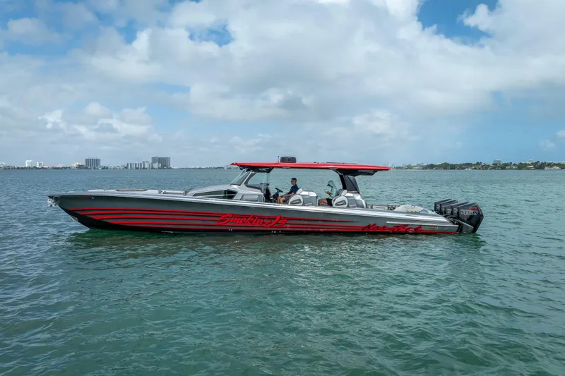 Slide: The Image of 2022 Nor-Tech 500 Sport Center Console boat on open water under cloudy sky. - 17