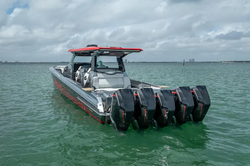 Slide: The Image of 2022 Nor-Tech 500 Sport Center Console boat with multiple engines on open water. - 20