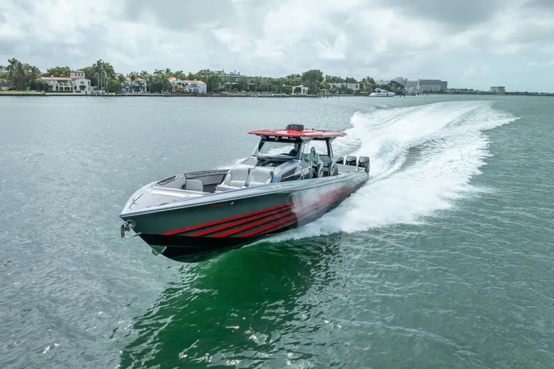 Slide: The Image of 2022 Nor-Tech 500 Sport Center Console cruising on water, showcasing sleek design and speed. - 26