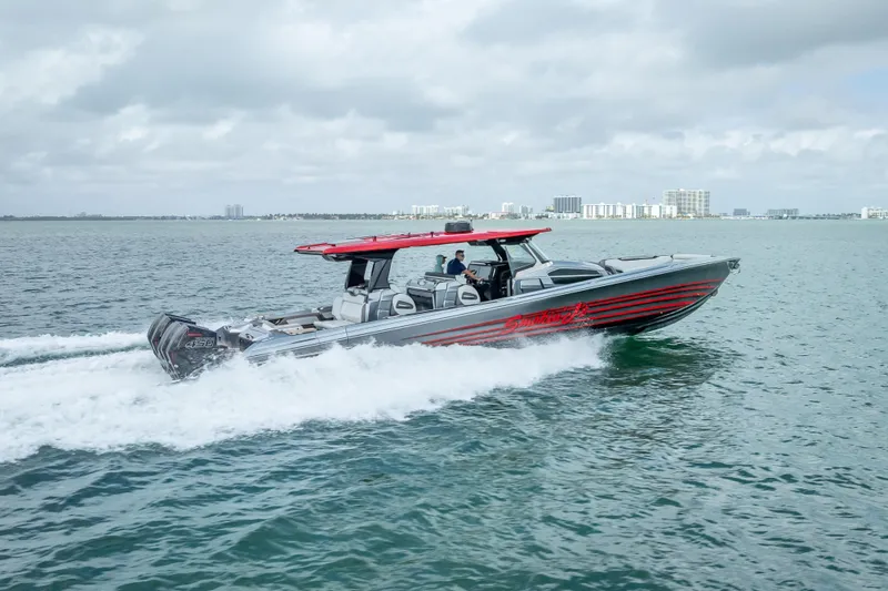 Slide: The Image of 2022 Nor-Tech 500 Sport Center Console cruising on open water. - 30