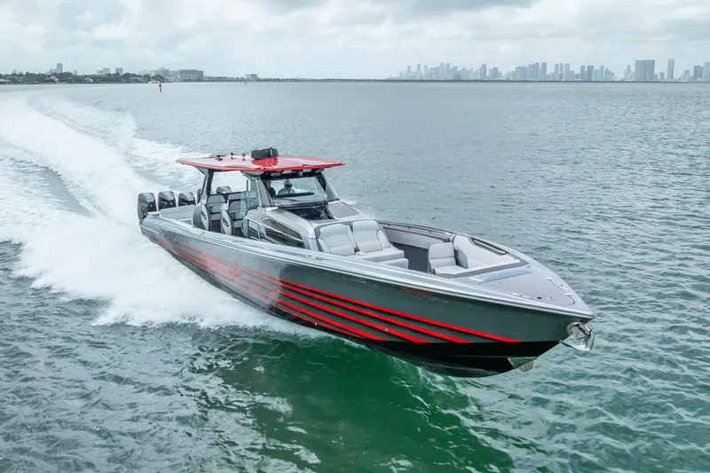 Slide: The Image of 2022 Nor-Tech 500 Sport Center Console speeding on water, city skyline in background. - 34