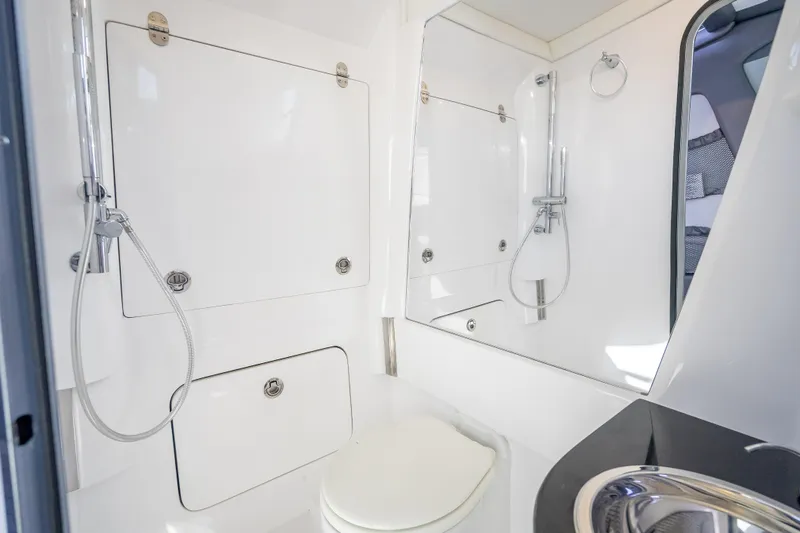 Slide: The Image of Luxurious bathroom in 2022 Nor-Tech 500 Sport Center Console boat, featuring modern fixtures. - 39