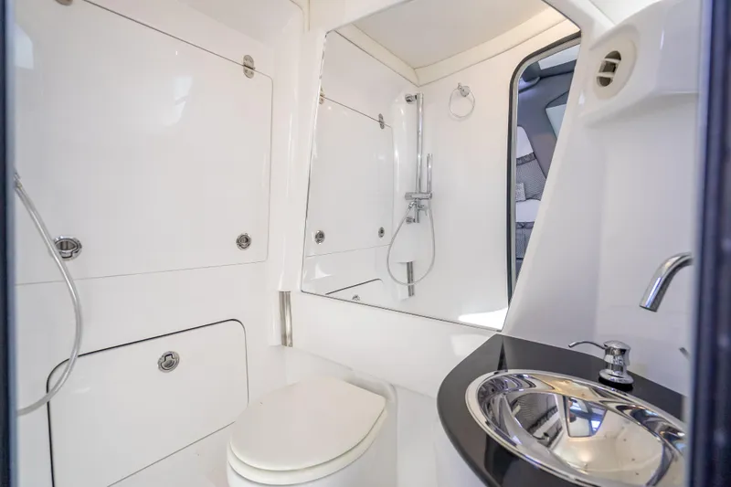 Slide: The Image of Luxurious bathroom in 2022 Nor-Tech 500 Sport Center Console boat. - 40