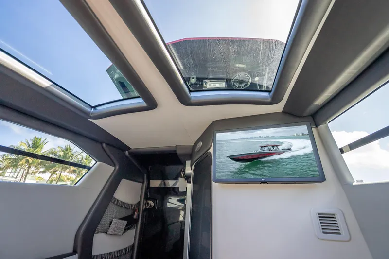 Slide: The Image of Interior view of 2022 Nor-Tech 500 Sport Center Console with skylights and TV display. - 46