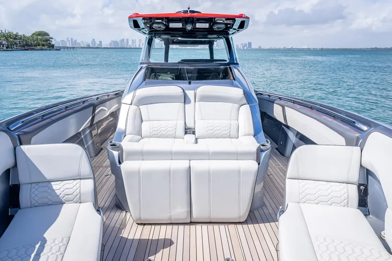 Slide: The Image of 2022 Nor-Tech 500 Sport Center Console boat with luxurious seating on open water. - 50