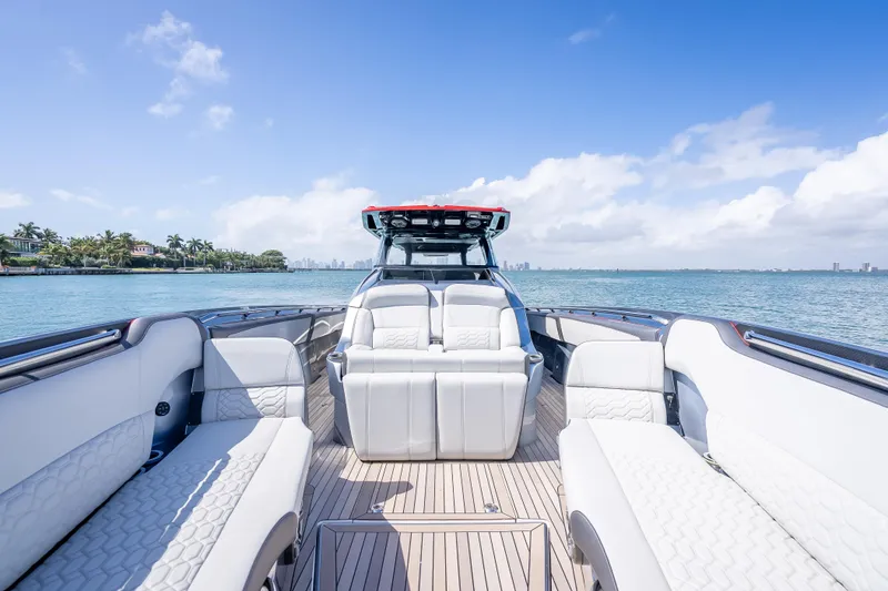 Slide: The Image of 2022 Nor-Tech 500 Sport Center Console boat with luxurious seating on a sunny day. - 51