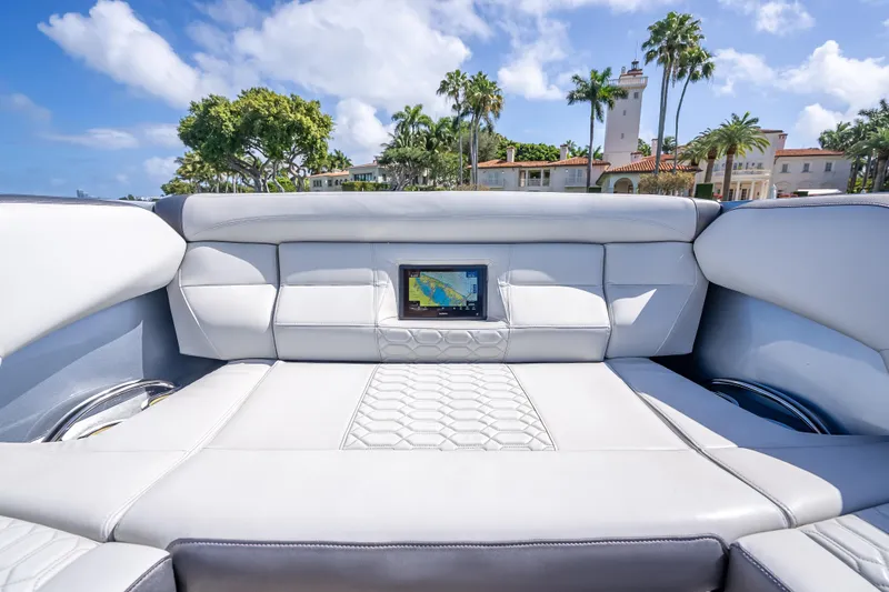 Slide: The Image of 2022 Nor-Tech 500 Sport Center Console interior with luxurious seating and touchscreen display. - 53