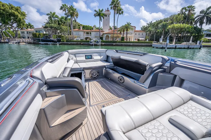 Slide: The Image of 2022 Nor-Tech 500 Sport Center Console luxury boat interior with waterfront view. - 54