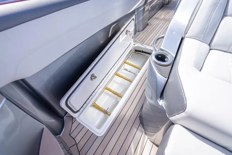 Slide: The Image of 2022 Nor-Tech 500 Sport Center Console interior with open storage compartment and seating. - 57