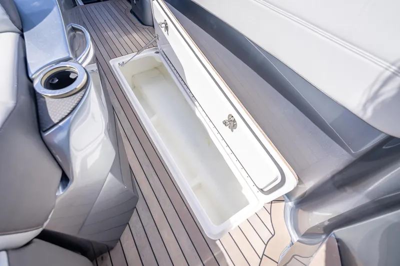 Slide: The Image of 2022 Nor-Tech 500 Sport Center Console interior storage compartment on teak deck. - 58