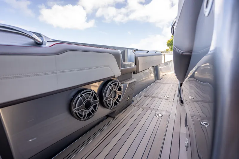 Slide: The Image of 2022 Nor-Tech 500 Sport Center Console boat interior with sleek design and modern speakers. - 61