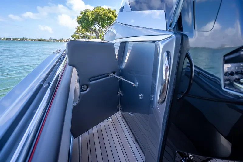 Slide: The Image of 2022 Nor-Tech 500 Sport Center Console boat with sleek design and open door. - 62